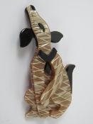 An overlaid plastic brooch in the style of Lea Stein in the form of a dog, 7.5cm in length.