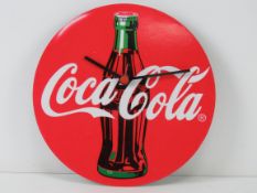 A Coca Cola wall clock 22cm diameter.