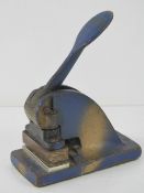 A late 19th early 20th century spring loaded cast iron letter stamp with plate for Crowell End,