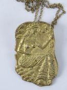 An unusual African silver gilt pendant/brooch in the form of a fertility goddess, 800 marks to back.