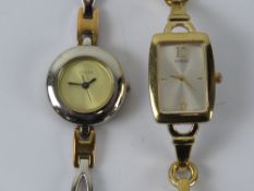 Two Guess ladies wristwatches.