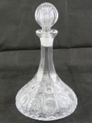 Two heavy cut glass 'ships' flat bottomed decanters, each with stopper.