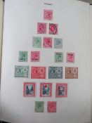 A stamp album containing a quantity of Victorian and 20thC stamps.