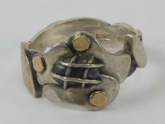 A HM silver Arts and Crafts style ring of abstract floral form.