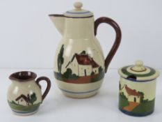 Torquay motto wear; coffee pot, lidded condiment pot, and small jug. Three items.