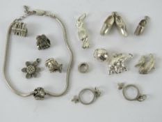 A quantity of silver charms inc chamilla 925 silver cow, sweet, elephant, HM silver Dutch clogs,