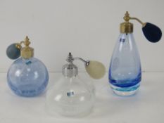 Three Caithness art glass atomiser perfume bottles, each with original Caithness label upon.