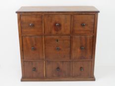 A wall mounted mahogany chest of nine box drawers, 52 x 50cm.