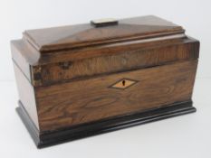 A fine quality Georgian rosewood sarcophagus tea caddy, original paper lined compartment,