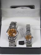 A 'His and Hers' stainless steel gents wristwatch and ladies wristwatch set, in presentation box.
