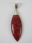 A 925 silver and red stone pendant, 6cm in length.