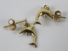 A 9ct gold pair of stud errings having dolphins upon.