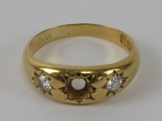 An 18ct gold 'gypsy' style ring having diamonds in star settings, central stone deficient,