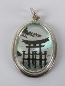 An unusual HM silver pendant having Japanese scene on silver background, hallmarked Sheffield, 3.