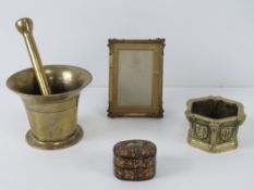 A small turned brass pestle and mortar,