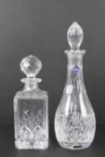 An Edinburgh crystal decanter having original labels upon and standing 34.5cm high.