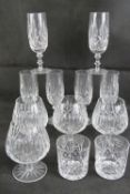 A set of four cut glass brandy balloons, together with a set of six cut glass champagne flutes,