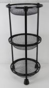 A cast metal floor-standing three tier fruit basket, 71cm high.