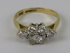 An 18ct gold diamond cluster ring having six round cut brilliant diamonds in marquise pattern with