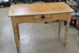 A good Victorian pine washstand, single drawer within shaped apron over ring turned legs,