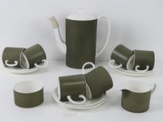 A Susie Cooper coffee service in 'Forest' c2094 pattern including six coffee cans and saucers,