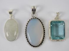 A moonstone pendant together with two other pendants, each stamped 925, 4.1-5.