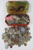 A large quantity of assorted world coinage including UK, Hong Kong, Romania, South Africa, India,