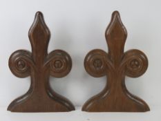 A pair of Victorian carved oak fleur-de-lis pew end heads each standing 39cm high.