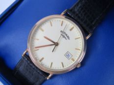 A Rotary wristwatch in box with paperwork, cream dial with date aperture on original Rotary strap,
