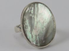 A silver and mother of pearl ring, stamped 925, size O-P, 2.9 x 2.3cm.