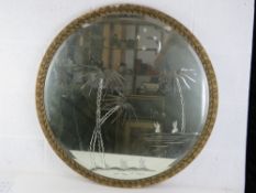 A decorative circular bevel edged wall mirror.