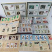Four albums of tea and cigarette cards together with twenty-one John Player cigarette card books.