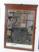 A 19th century pedimental bevelled edge walnut and mahogany wall mirror, 77 x 53cm.