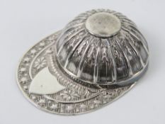 A HM silver caddy spoon in the form of a jockeys peaked riding hat, hallmarked Sheffield 1971, 10.