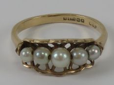 A 9ct gold and pearl ring, the basket setting holding five graduated pearls, hallmarked 375, 2.1g.