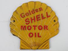 A cast metal wall plaque,