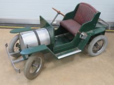 A fine quality hand built child's 12v battery car, wooden frame with steel front and rear bumpers,