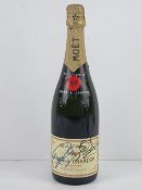 A hand signed bottle of Moet & Chandon Brut Imperial champagne.