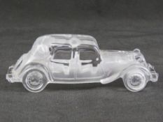 A glass paperweight in the form of a vintage Citroen motorcar, 19cm in length.
