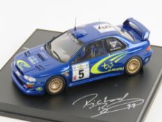 A Trofeu miniature Subaru Impreza Burns/Reid racing car signed by both drivers,