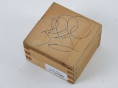 A tongue and groove Honda Legend wooden box, signed to the base Nigel Mansell.