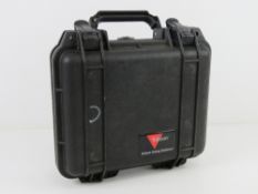 A Trijicon Pelican case with accessories