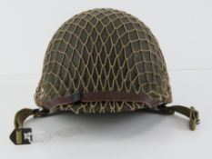 A WWII US Army McCord helmet having heat
