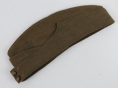 A WWII British side cap, with original l