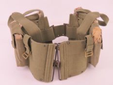 Four US BAR un-issued magazines in canvas pouch.