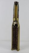A Russian 57mm anti-aircraft shell cutaway, case and head with stencilling upon.