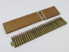 A Japanese 7.7 Woodpecker strip with 30 rounds in box.