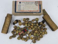 A quantity of gold braids Navy brass buttons and medal ribbons contained within a Gieves box having