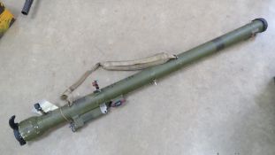 A deactivated Soviet SA-7 Grail rocket tube having flip up sights and sling.