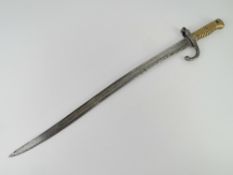 A French 1867 model Chassepot Yataghan bayonet engraved and dated St Etienne...